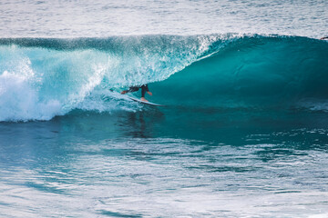 Surfer in a perfect barrel wave