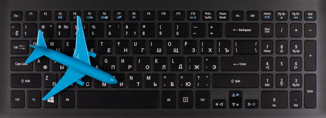 computer keyboard and aircraft model