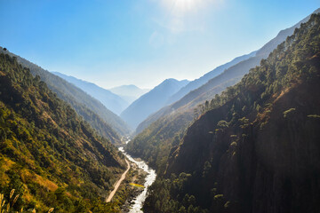 Obraz premium Beautiful curving river in the Himalaya mountains in Nepal. Tamang Heritage Trail and Langtang trek day 4 from Nagthali to Lingling