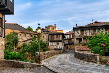 view of the bridge entrance to the picturesque rural village of La Alberca in Salamanca, Spain - obrazy, fototapety, plakaty