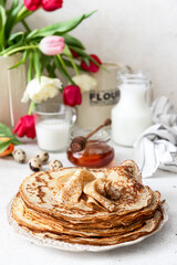 Stack of traditional russian pancakes blini on wooden background. Maslenitsa traditional Russian festival meal.	