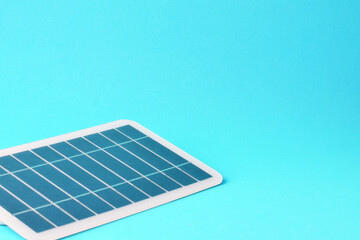 Photovoltaic solar panel on blue background and copy space.