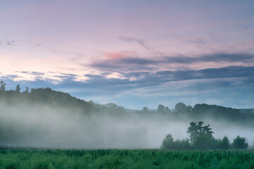 dawn in fog covered fields in France