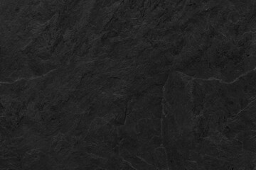 Dark grey black slate background or texture. Black granite slabs background.  © surasak