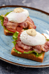 toasts with poached egg and bacon