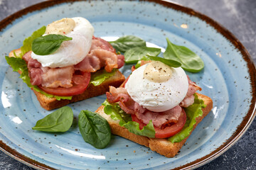 toasts with poached egg and bacon