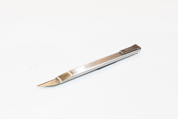 stationery knife on white background isolate cutter stationery