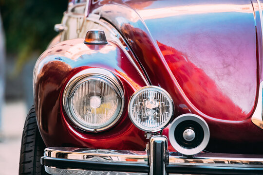 Rome, Italy - October 20, 2018: Close Up Headlight Of Old Retro Vintage Red Color Volkswagen Beetle Car Parked At Street