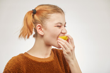 girl eats lemon