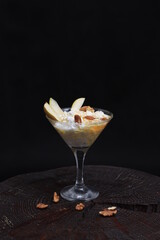 Cottage cheese with honey and nuts in a glass