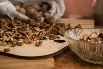 Peeled and shelled walnuts are scattered randomly on the table.