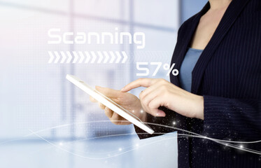 Futuristic and technological scanning. Hand touch white tablet with digital hologram sign on light blurred background. Global technologies concept.