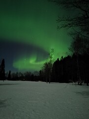 night landscape with Moon - aurora - beautiful Green northen lights