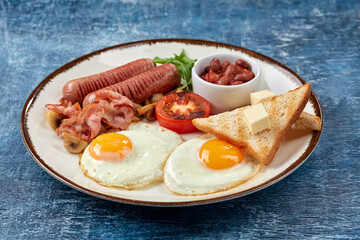 traditional breakfast with egg and sausages