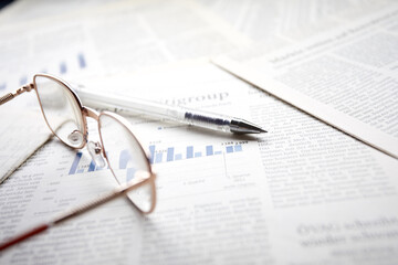 eyeglasses on the newspaper pages