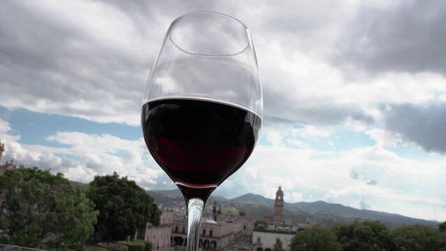 Glass of red wine in downtown 