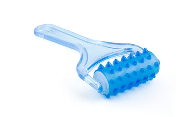 Blue plastic massager on Isolated White Background. Close-up. Full depth of field.