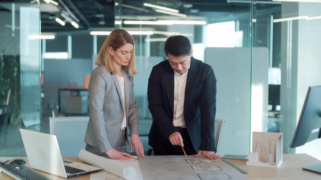 Group of engineer architectural. Team Architect Design Project Meeting Discussion working with partner tools on model building and blueprint. Construction developer designer inspect the plan in office