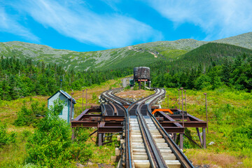 Mount Washington in summer with antique cog train track. Viewed from cog train on Mount Washington in White Mountain, New Hampshire NH, USA. - obrazy, fototapety, plakaty