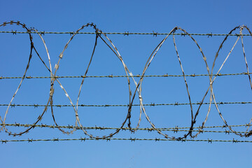 Barbed wire border fence and defense.