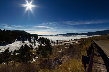 Sunny frozen mountain lake