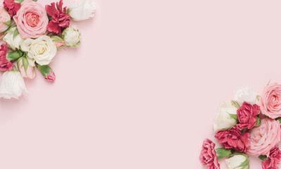 Dianthus and roses arranged in the corners of a pastel pink background. Romantic, feminine template.