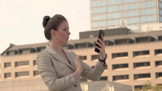 Businesswoman shocked by news on tablet