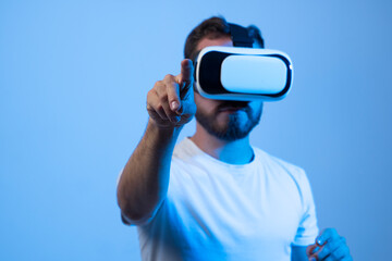 Young man developer working with a VR headset in a virtual world and create new products and applications.