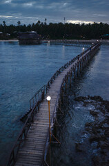 Beautiful landscape. Dusk and dawn on the seashore. Wooden bridge on the beach, Siargao Island Philippines.