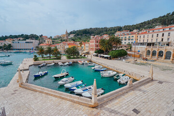 Hvar Old Town Promenade. Sea coast in Dalmatia,Croatia. A famous tourist destination on the Adriatic sea. Old town and marina. - obrazy, fototapety, plakaty