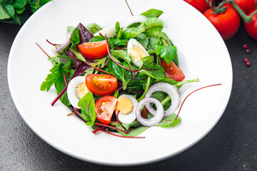 Easter salad vegetable quail egg tomato mix leaves healthy meal food snack on the table copy space food background 