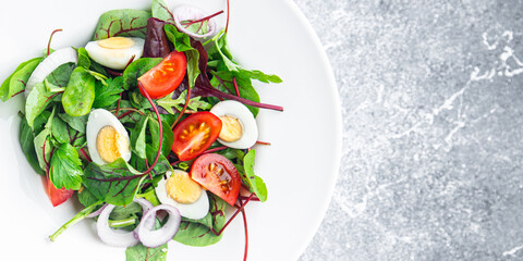 Easter salad vegetable quail egg tomato mix leaves healthy meal food snack on the table copy space food background 