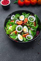 Easter salad vegetable quail egg tomato mix leaves healthy meal food snack on the table copy space food background 
