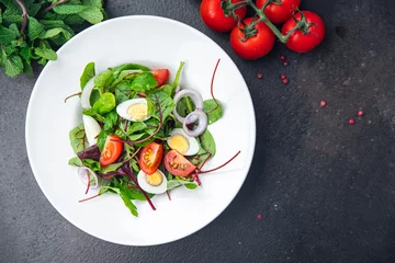 Foto auf Acrylglas Easter salad vegetable quail egg tomato mix leaves healthy meal food snack on the table copy space food background  © Alesia Berlezova