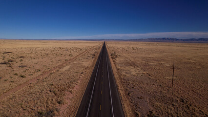 Lonely Road in the desert from above New Mexico