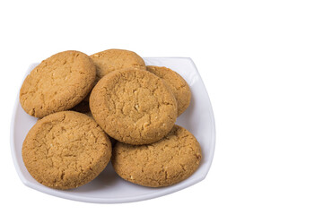 Close up view of white plate with oatmeal cookies isolated on white background. 