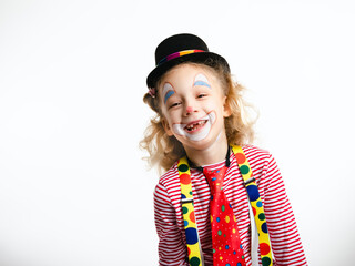 Funny cute kid clown with tooth gap. Isolated on white background concept. Celebrating a carnival...