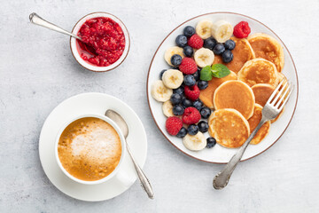 Keto pancakes made of diet flour or almond flour, served with berries.