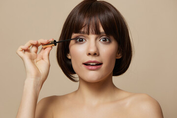 Fototapeta premium brunette Mascara cosmetics attractive look posing close-up Lifestyle