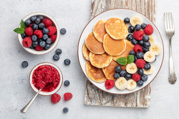 Keto pancakes made of diet flour or almond flour, served with berries.