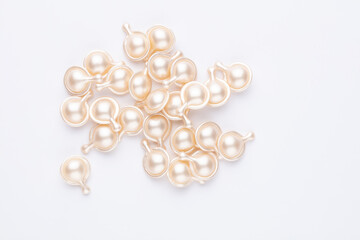 Hyaluronic acid capsules isolated on white background.
