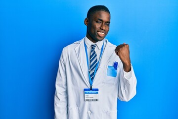 Young african american man wearing scientist uniform smiling with happy face looking and pointing...