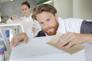 home improvement worker smoothing surface