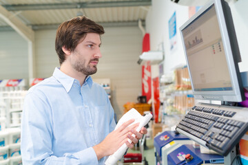 Naklejka na ściany i meble client looking at shop screen