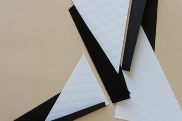 abstract geometric paper background in white and black on beige