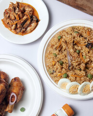 Nigeria Jollof rice with spicy chicken and side sauce