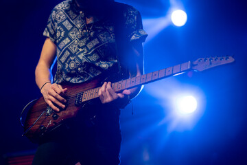 Close-up of guitarist in concert