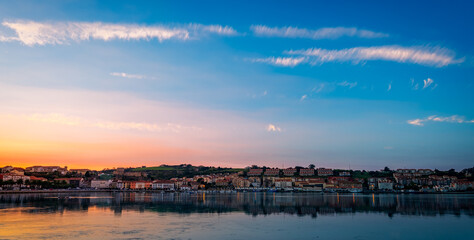 Spectacular autumn sunset, with the view of the town and the port of San Vicente de la Barquera. Cantabria, Spain.