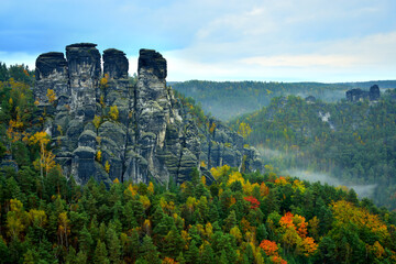 Saxon switzerland rathen bastei - Gansfelsen - sandstone rock formations autumn forest clouds mist moody