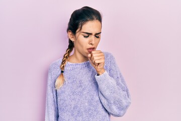 Young hispanic girl wearing casual clothes feeling unwell and coughing as symptom for cold or bronchitis. health care concept.